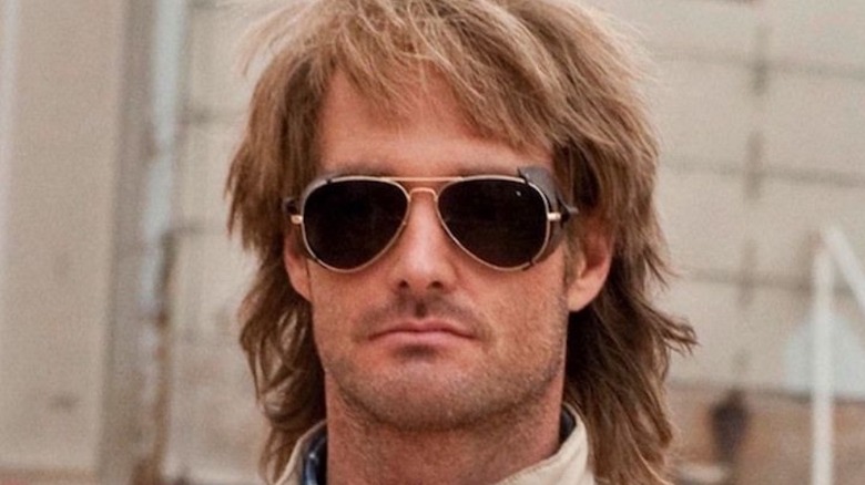 MacGruber stoically sports aviator sunglasses