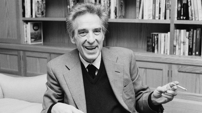 John Cassavetes smoking a cigarette