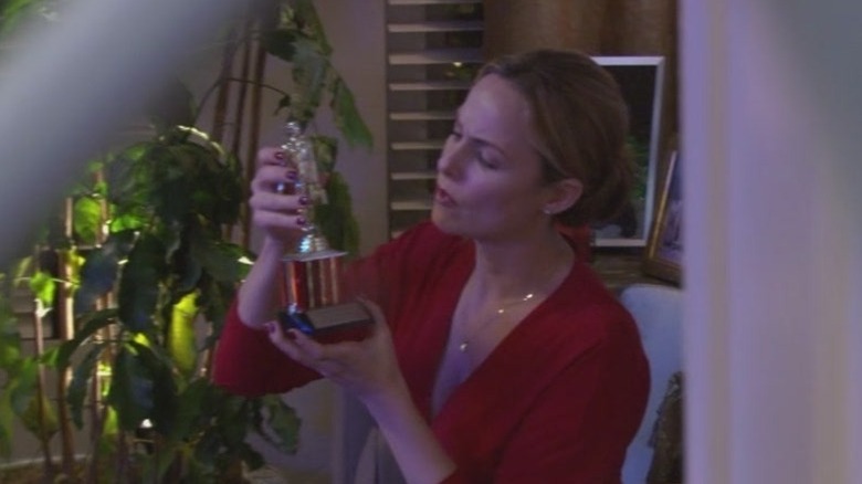 Jan Levinson fixing a trophy