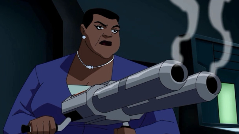 Amanda Waller holding a smoking weapon