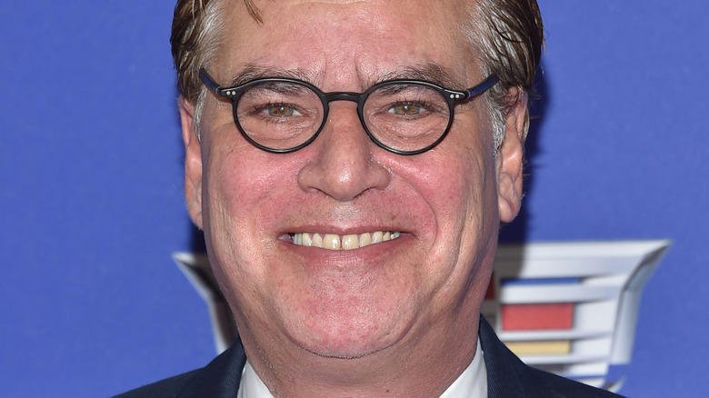 Aaron Sorkin grinning for camera