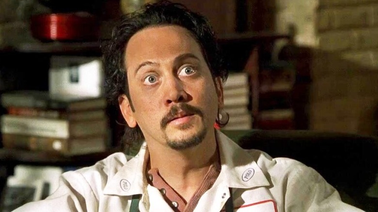 Rob Schneider in an apron