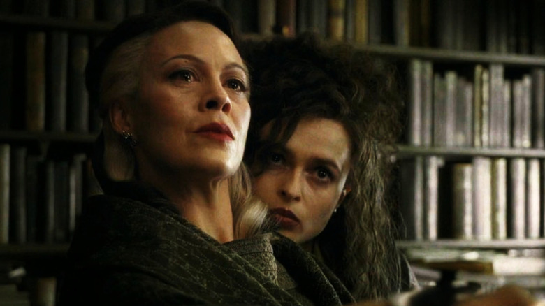 Narcissa Malfoy and Bellatrix Lestrange looking theatreningly at Severus Snape