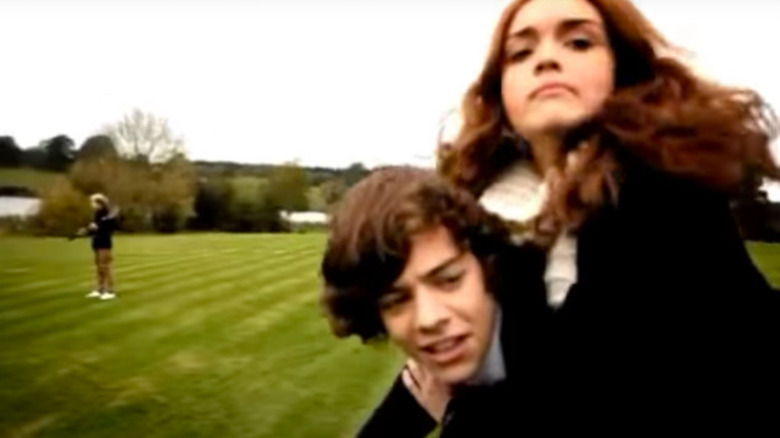 Olivia Cook on Harry Styles' back