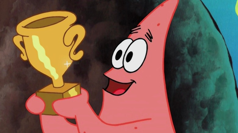 Patrick holding trophy