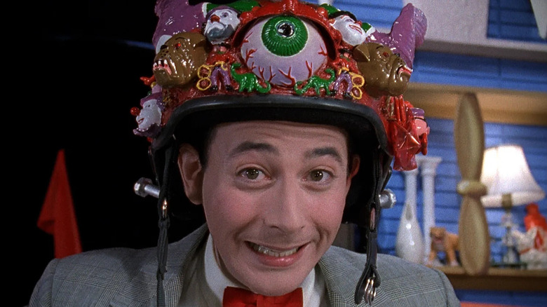 Pee-wee smiles wearing his crazy bike helmet