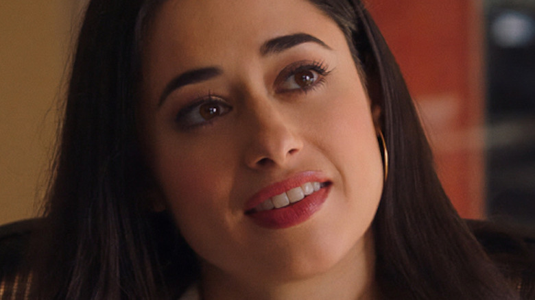 Jeanine Mason smiles as Liz