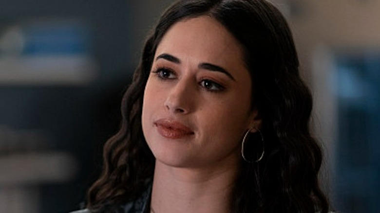 Jeanine Mason smiles as Liz