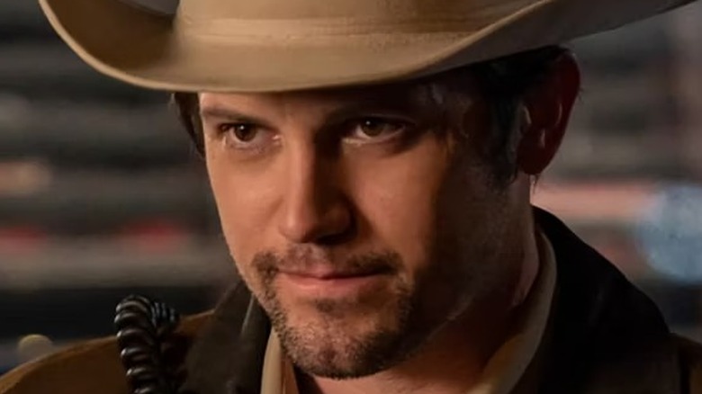Nathan Dean Parsons smiles as Max