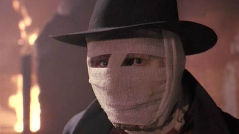 Liam Neeson face covered