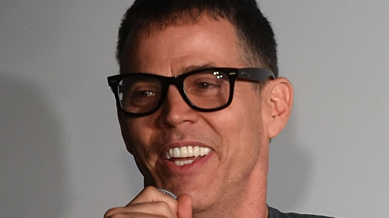 Steve-O wearing glasses and smiling 