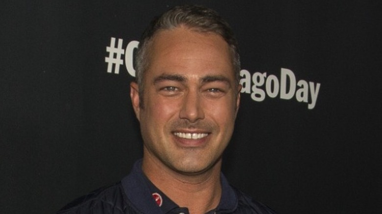 Taylor Kinney smiling for camera