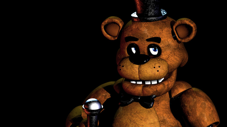 Freddy Fazbear creepily holding microphone