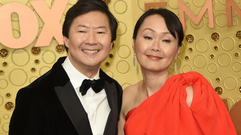 Ken and Tran smiling on the red carpet