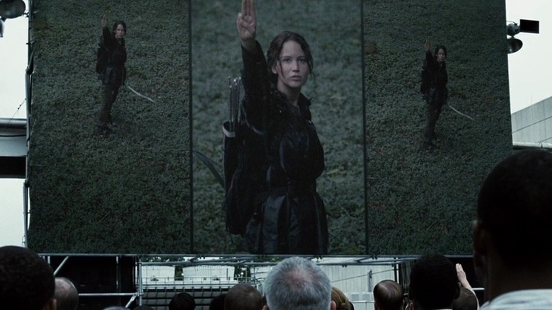 Katniss saluting on TV