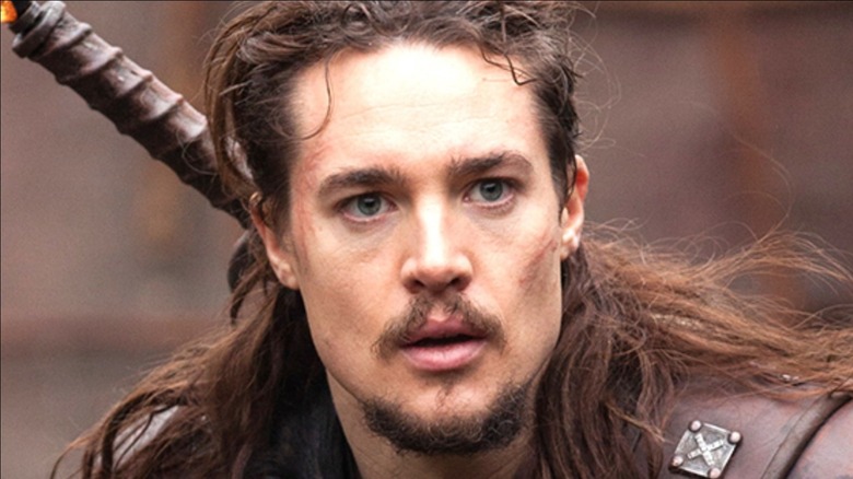 Alexander Dreymon as Uhtred with sword in The Last Kingdom