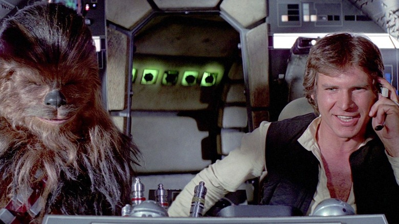 Chewbacca and Han flying the Millennium Falcon