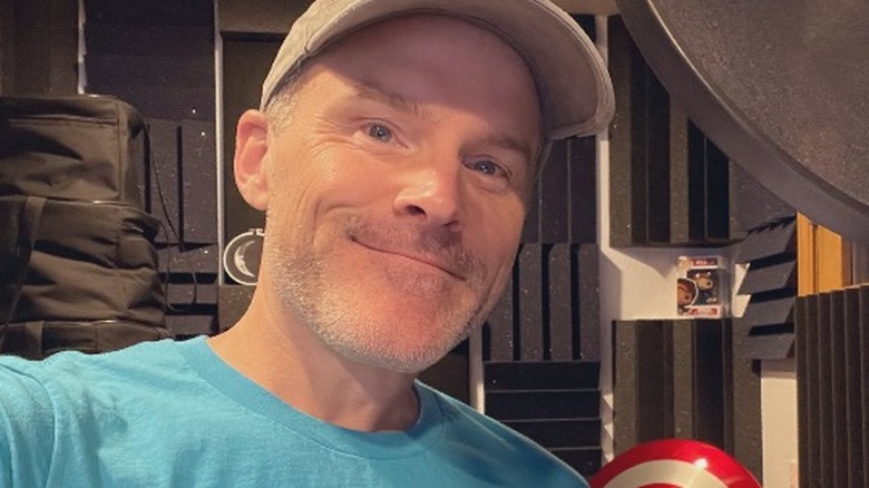 Roger Craig Smith selfie with Sonic plush and shield
