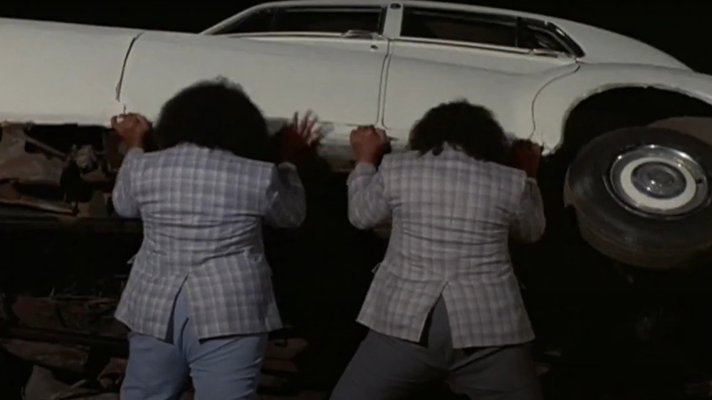 The Wild Samoans turn over a car in Body Slam (1986)
