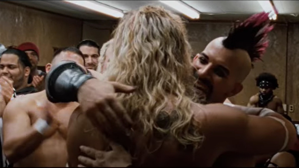 Tommy Rotten, played by WXW wrestler Tommy Suede, embraces Mickey Rourke in The Wrestler