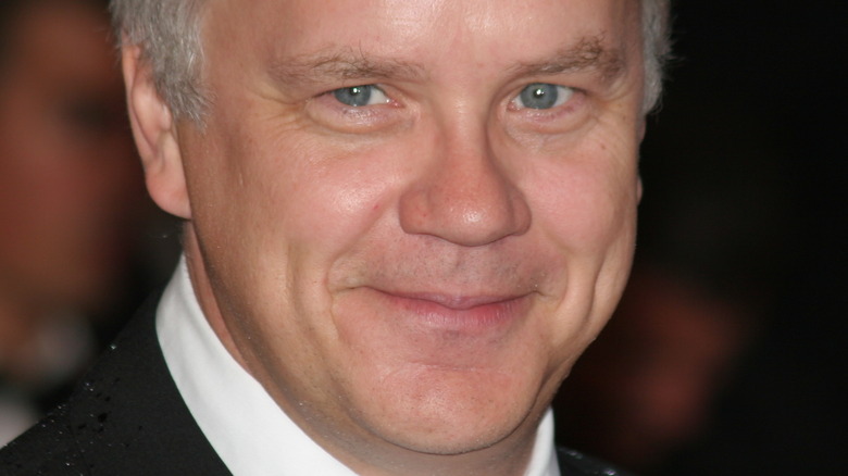 Tim Robbins smiling and waving