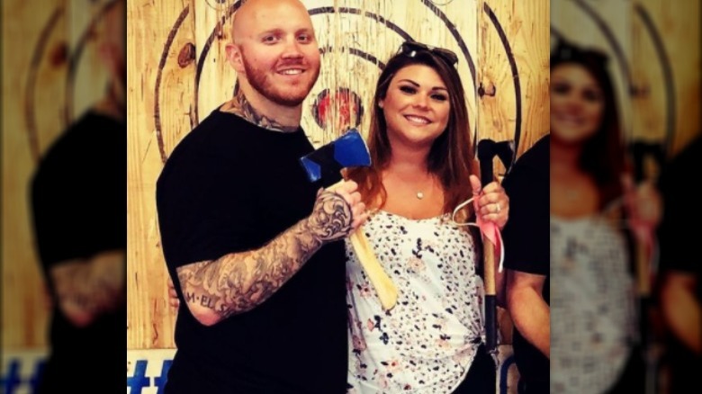 Tim and Alexis throwing axes