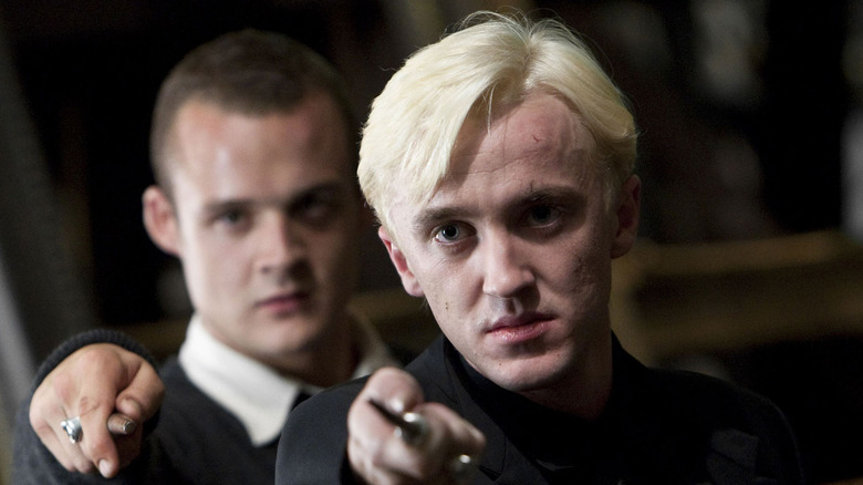Draco and Crabbe pointing wands