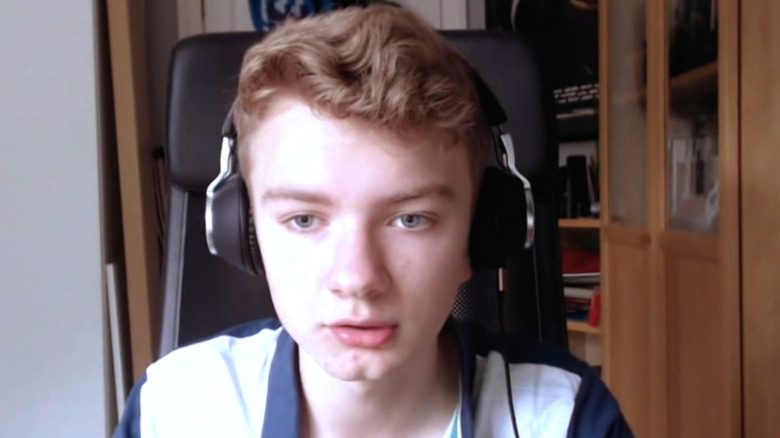 Young Tommyinnit wearing headphones