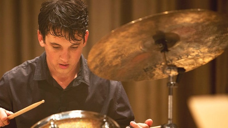 Andrew Neiman wincing while drumming