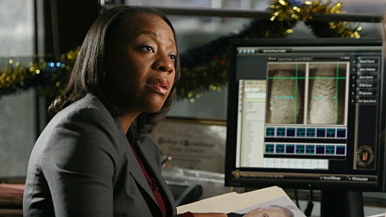 Marianne Jean-Baptiste sitting at a desk with a computer