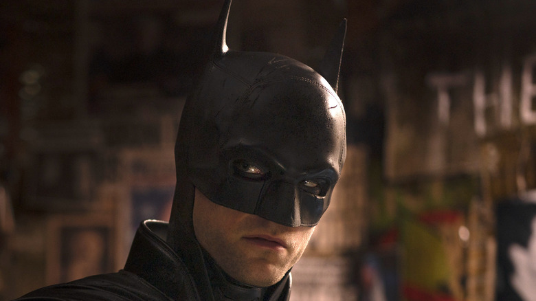 Robert Pattinson wears Batman cowl