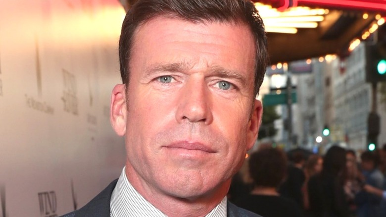 Taylor Sheridan posing on a red carpet