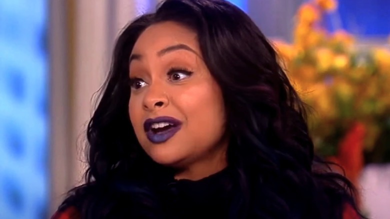 Raven-Symoné talking, wearing dark purple lipstick