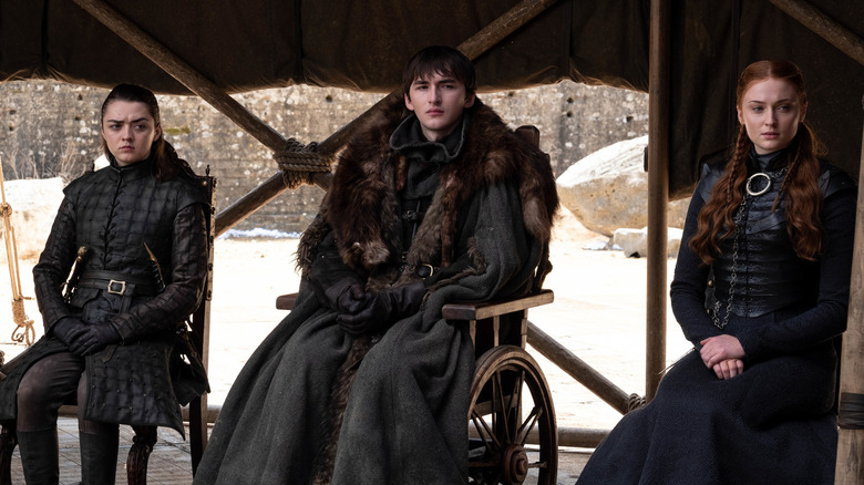 Maisie Williams, Isaac Hempstead Wright, Sophie Turner sitting in character
