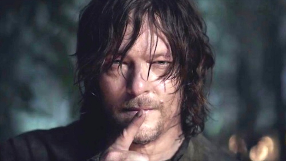 Daryl Dixon with a finger to his mouth