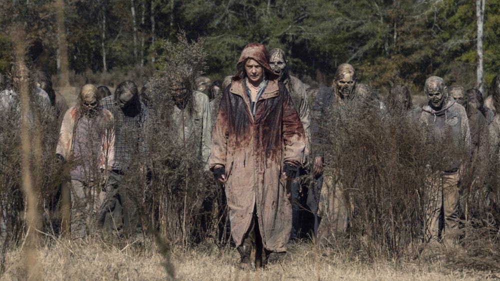 Carol (Martina McBride) walks through a horde of walkers on The Walking Dead