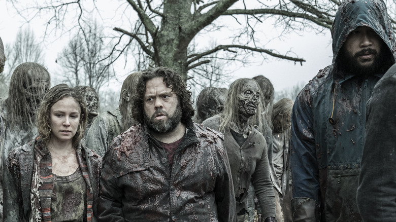Jules, Luke, and Jerry with walkers on The Walking Dead