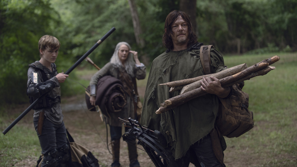 Daryl Dixon holding firewood