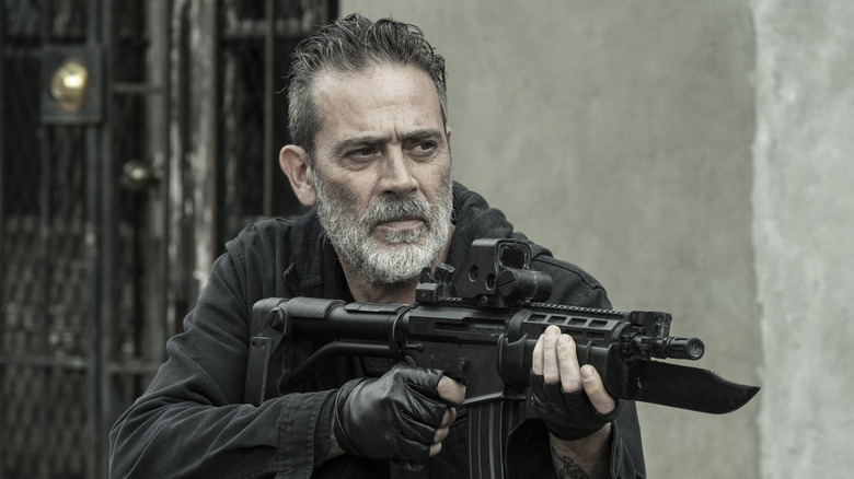 Negan wielding a modified rifle