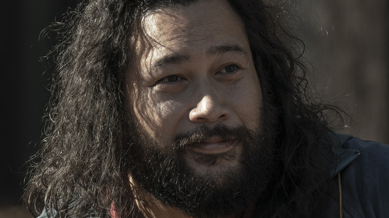 Jerry riding in a cart on The Walking Dead 