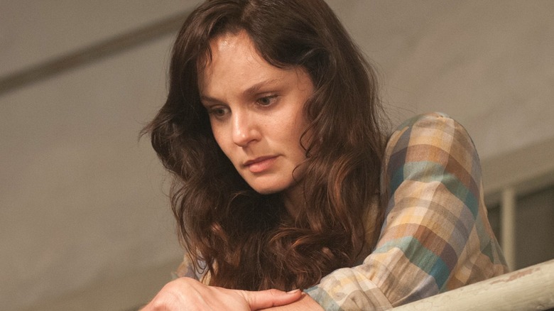 Lori Grimes leaning on a railing