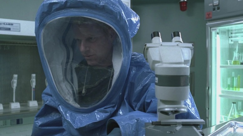 Dr. Jenner wearing biohazard suit in a lab in "The Walking Dead" (2010-2022)