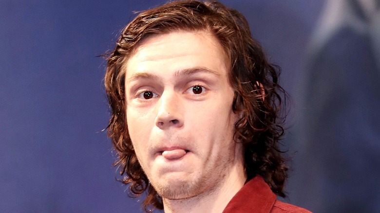 Evan Peters sticking tongue out