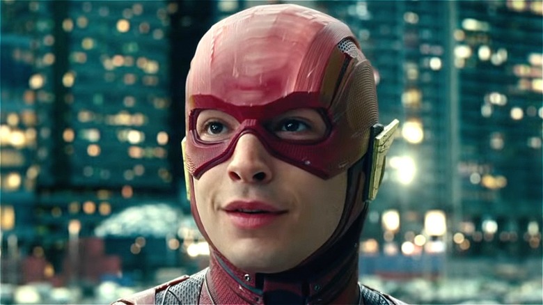 Ezra Miller smiles as The Flash in Justice League