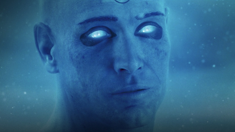 Doctor Manhattan standing in snow