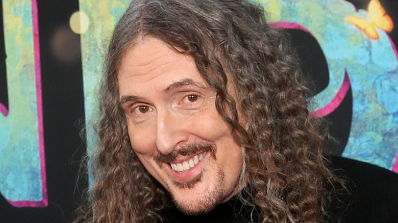 Weird Al Yankovic smiling into camera