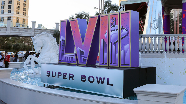 A display of the Super Bowl logo sits in a fountain