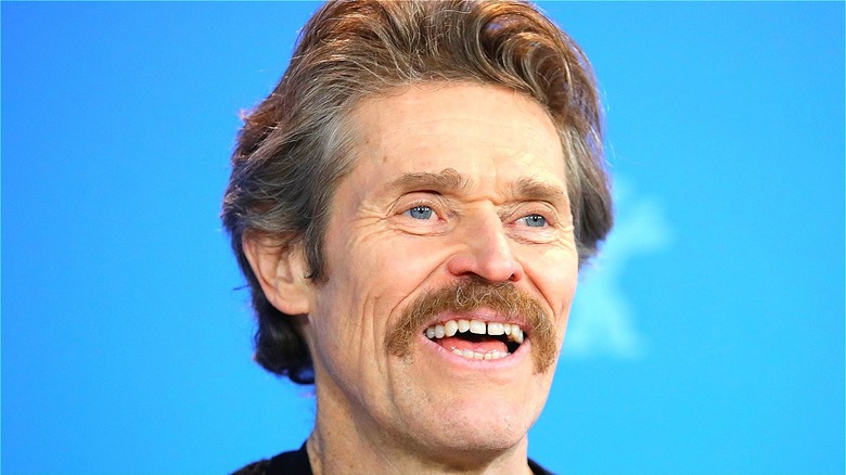 Willem Dafoe smiling