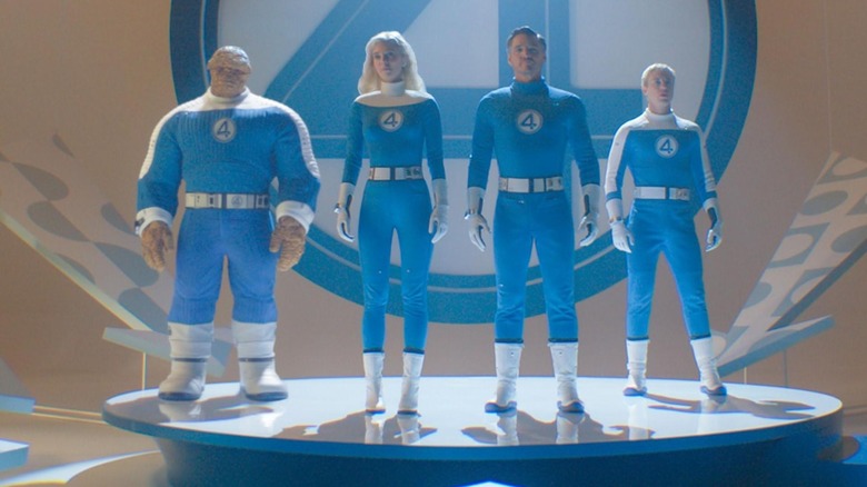 The Fantastic Four standing in their super-suits