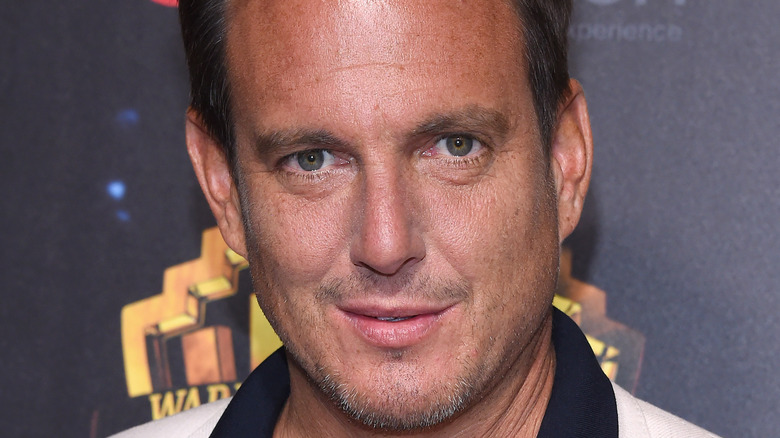 Will Arnett wears a neutral expression